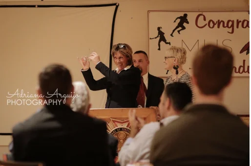 Inductee celebrating at the podium